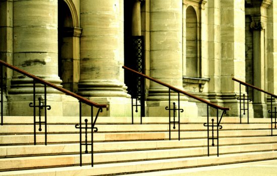 The Capitol steps with column and handrails leading into the building.
