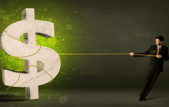A white male with black hair, wearing a black suit, pulling a giant money symbol with a lassoed rope towards him.