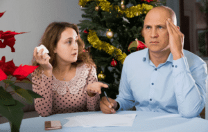 A couple arguing at a table.