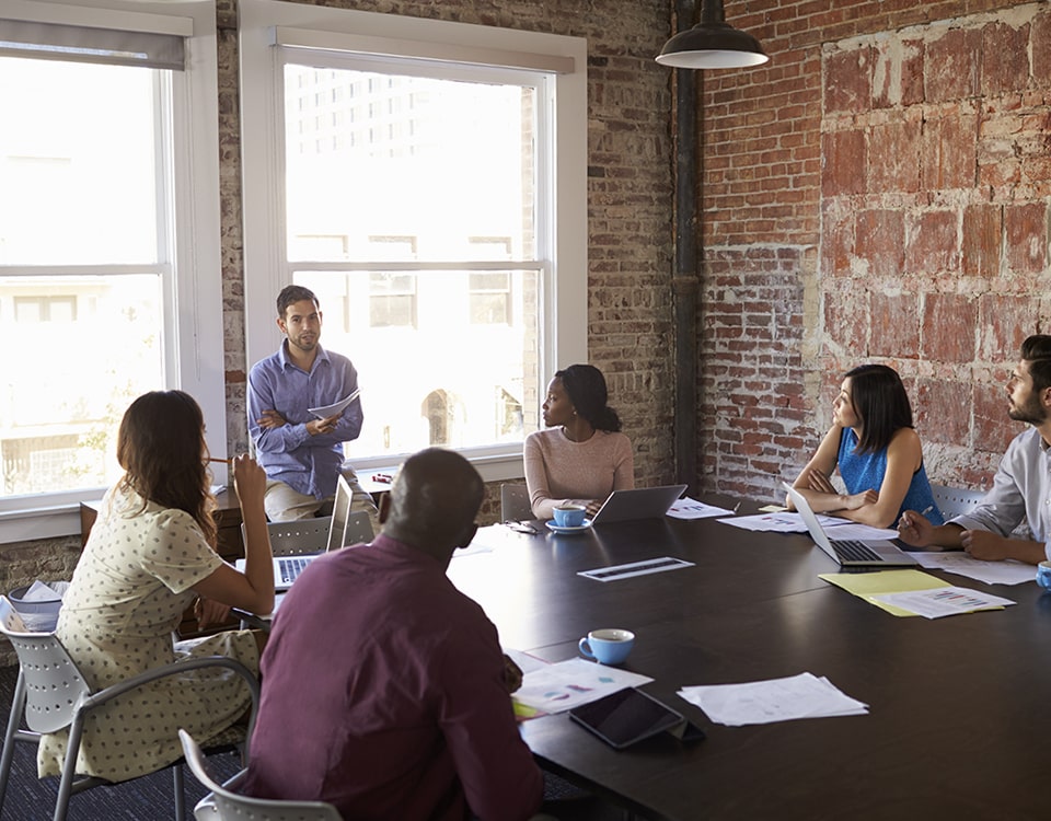 Businessman Standing To Address Boardroom Meeting