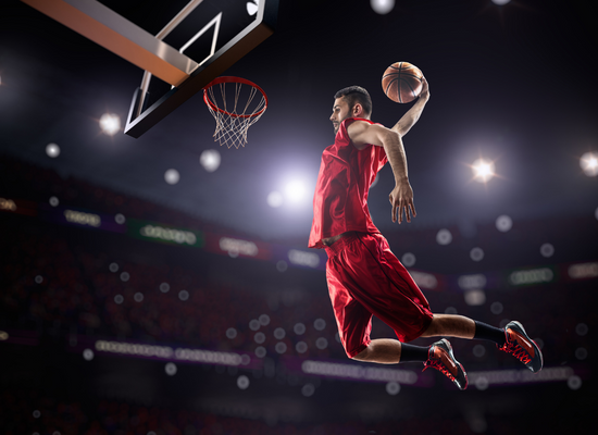 basketball player making a slam dunk