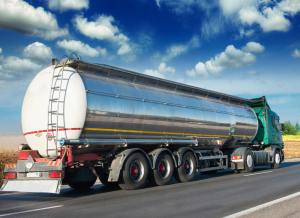 A fueling truck driving down the highway.