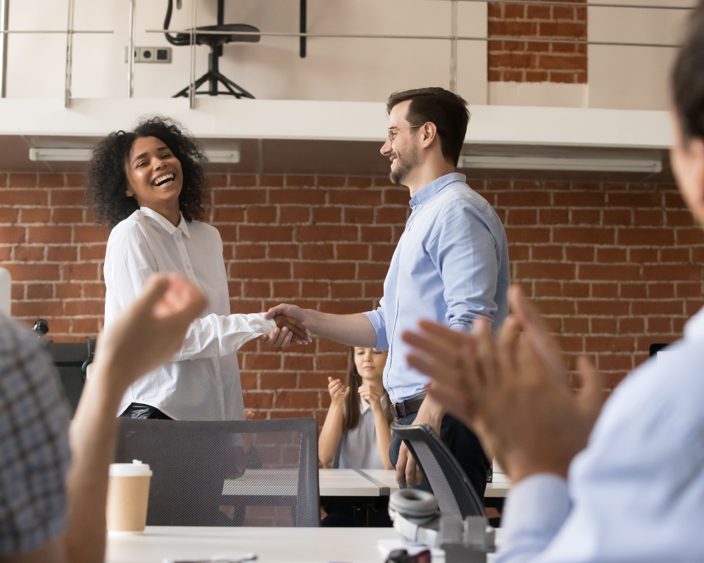 person being congratulated on promotion