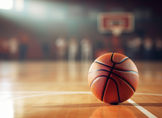 A basketball on a basketball court in the background.