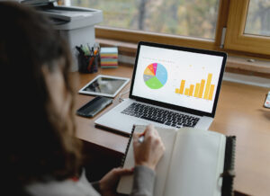 Woman conducting Compensation and Benefits Analysis for strategic value