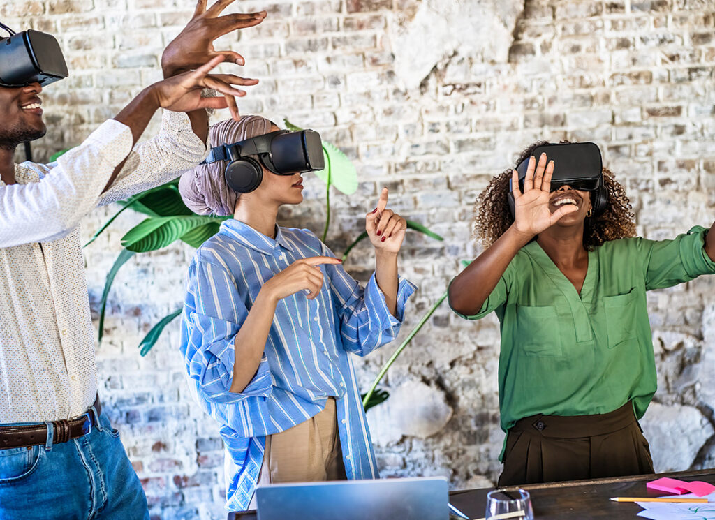 Future-Proofing Your HR Growth Strategies . Future of workforce using VR headsets in a contemporary office. Professionals experiencing immersive technology, showcasing innovation and teamwork. Insights from Mercer’s Workforce 2.0 Report Can Help Us “Unlock Human Potential in a Machine-Augmented World”