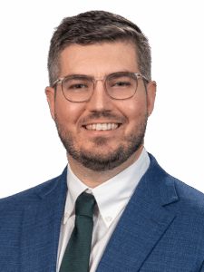 Professional headshot of Caleb Brogan.