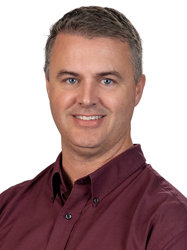 Professional headshot of Zach Hicken in blue to green gradient overlay.