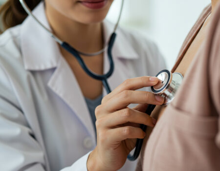 Doctor - Checkup Doctor performing a check up on a patient in the office.
