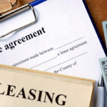 Lease agreement papers, money, and leasing documents on a desk, symbolizing lease management.