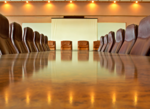 Imposing-looking conference table and chairs in a Wall Street boardroom