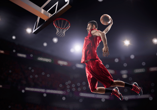 basketball player making a slam dunk