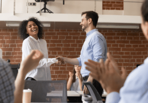 Jan 2023 promotions news item featured image person being congratulated on promotion