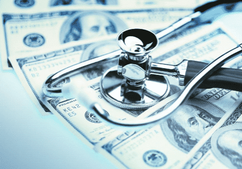 money under stethoscope with blue filter